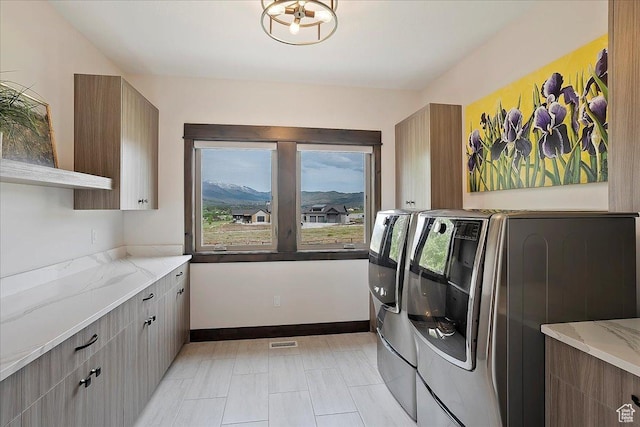 3749 N Eagle Ridge Dr E, Eden, UT 84310 - laundry room with separate washer and dryer and cabinet space