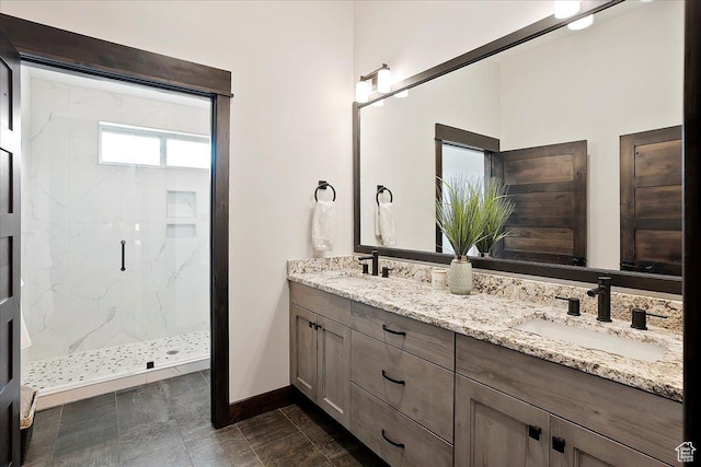 3749 N Eagle Ridge Dr E, Eden, UT 84310 - bathroom with a marble finish shower, baseboards, and double vanity