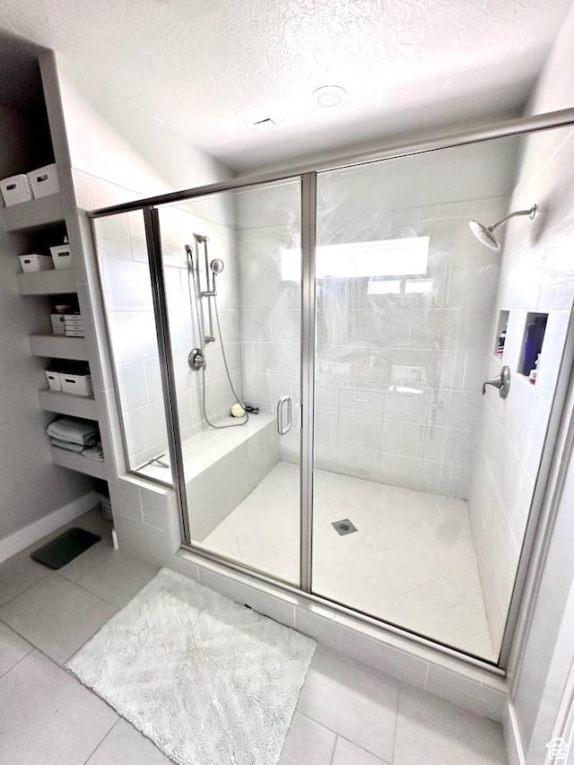 3146 W 1280 N, Provo, UT 84601 - full bathroom with tile patterned floors, a textured ceiling, a stall shower, and baseboards