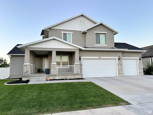 3146 W 1280 N, Provo, UT 84601 - view of front of property featuring a porch, stone siding, a front lawn, and concrete driveway