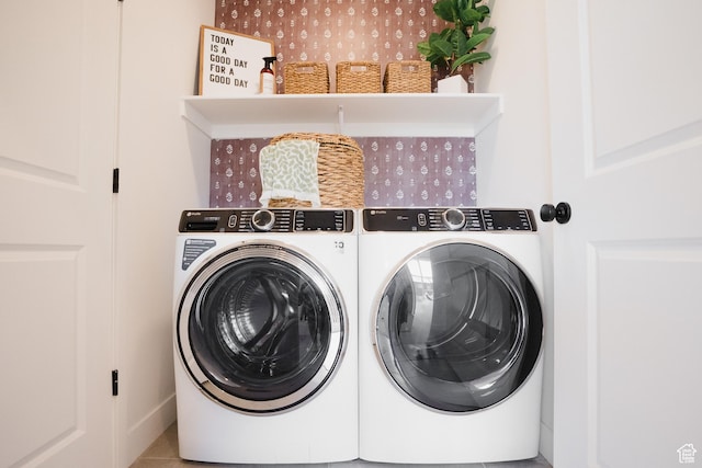 washroom with independent washer and dryer