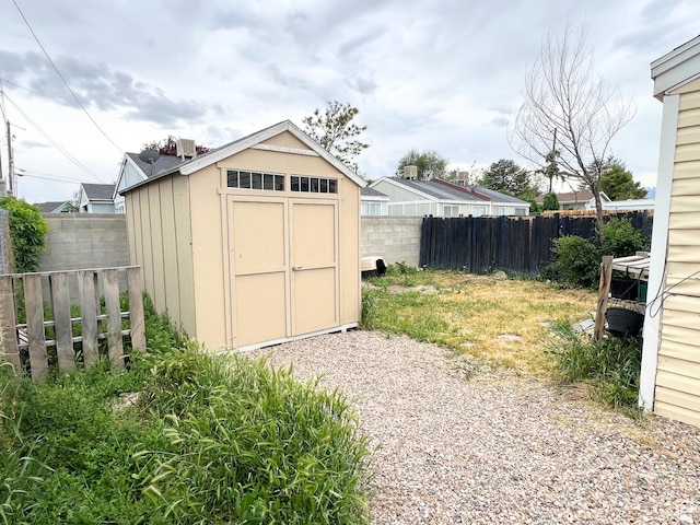 3272 W 3540 S Unit A-B, West Valley City, UT 84119 - view of shed featuring a fenced backyard