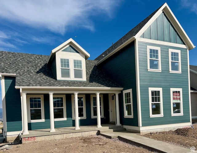 11121 S Bingham Rim Rd W Unit 5-425, South Jordan, UT 84009 - view of front facade featuring a porch, a shingled roof, and board and batten siding