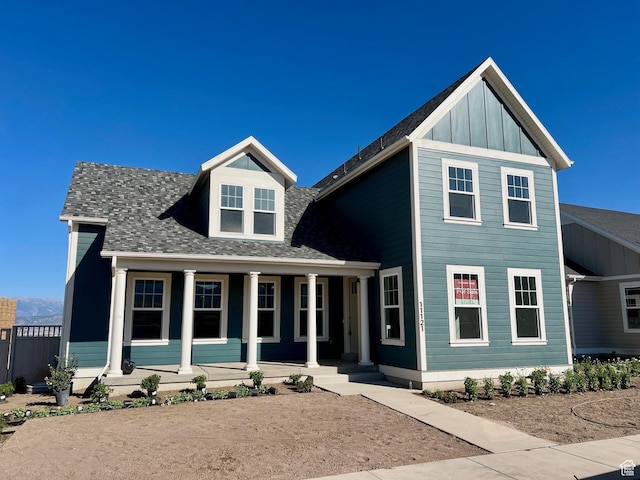 11121 S Bingham Rim Rd W Unit 5-425, South Jordan, UT 84009 - view of front of house featuring a porch, roof with shingles, and board and batten siding