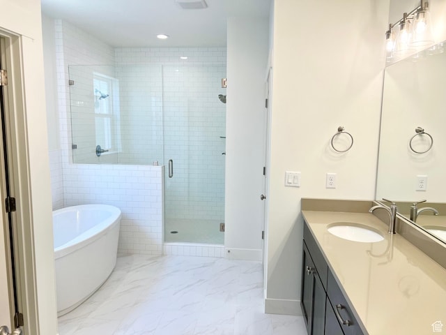 11121 S Bingham Rim Rd W Unit 5-425, South Jordan, UT 84009 - full bathroom featuring vanity, a soaking tub, a shower stall, marble finish flooring, and recessed lighting