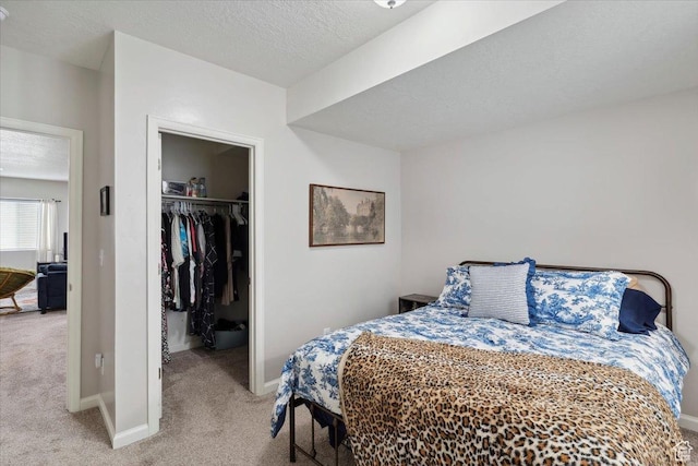 3191 N 1500 E, Layton, UT 84040 - bedroom with light colored carpet, a spacious closet, a closet, a textured ceiling, and baseboards