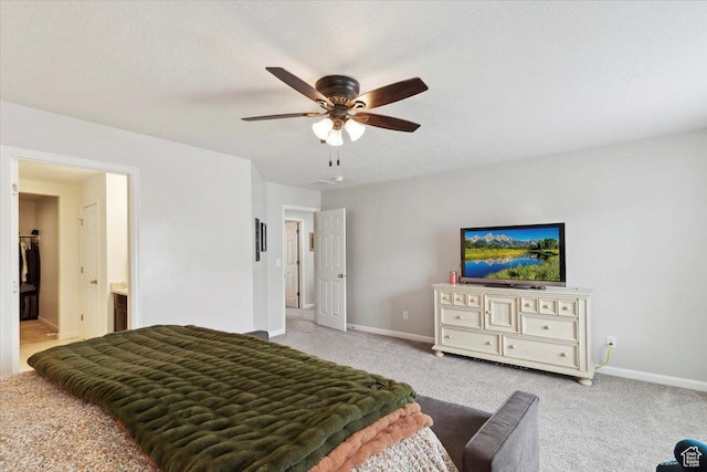3191 N 1500 E, Layton, UT 84040 - bedroom featuring baseboards, light colored carpet, ceiling fan, and ensuite bath