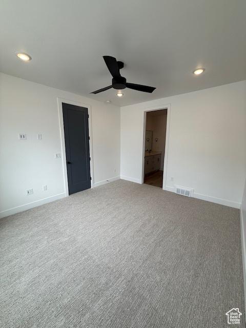 carpeted empty room featuring a ceiling fan, baseboards, and recessed lighting
