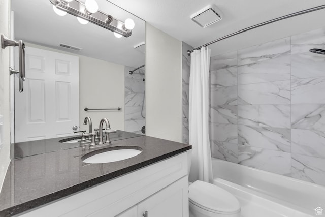 full bath with shower / tub combo, toilet, and vanity