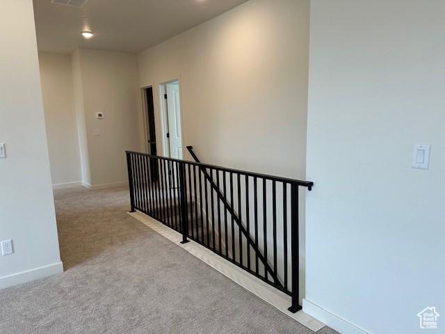 1146 E Hollyhock Way, Layton, UT 84040 - hallway with an upstairs landing and carpet