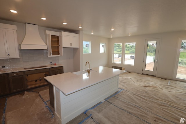 1146 E Hollyhock Way, Layton, UT 84040 - kitchen with custom range hood, black electric stovetop, recessed lighting, decorative backsplash, and light countertops