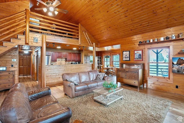 448 S 8600 E, Huntsville, UT 84317 - living room featuring ceiling fan, light wood-type flooring, wood walls, high vaulted ceiling, and wooden ceiling