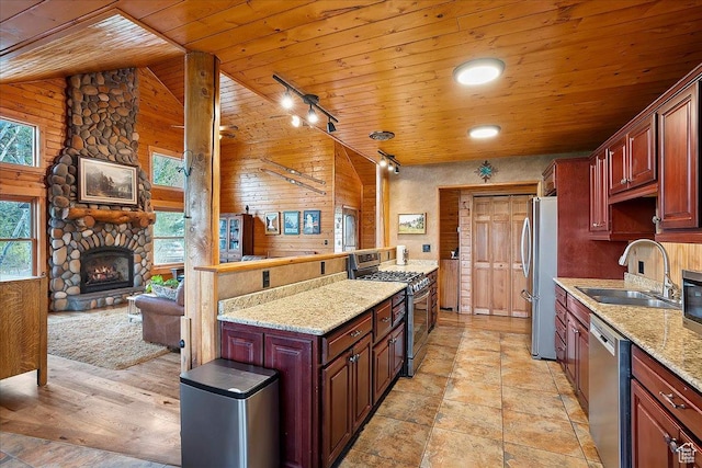 448 S 8600 E, Huntsville, UT 84317 - kitchen with stainless steel appliances, wood ceiling, a fireplace, a sink, and light stone countertops