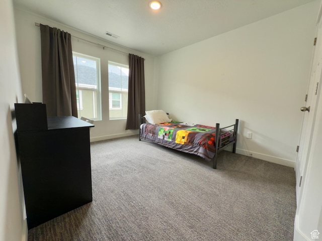 bedroom with baseboards and carpet flooring