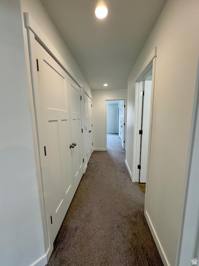 corridor with carpet, baseboards, and recessed lighting