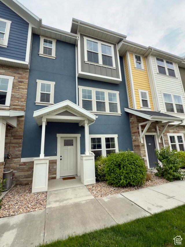 353 N 750 E, Vineyard, UT 84059 - townhome / multi-family property featuring stone siding, stucco siding, and board and batten siding