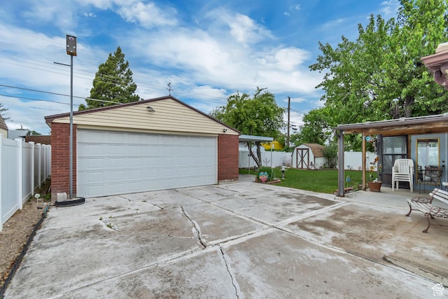 3238 S Maple Way, West Valley City, UT 84119 - detached garage featuring a storage shed