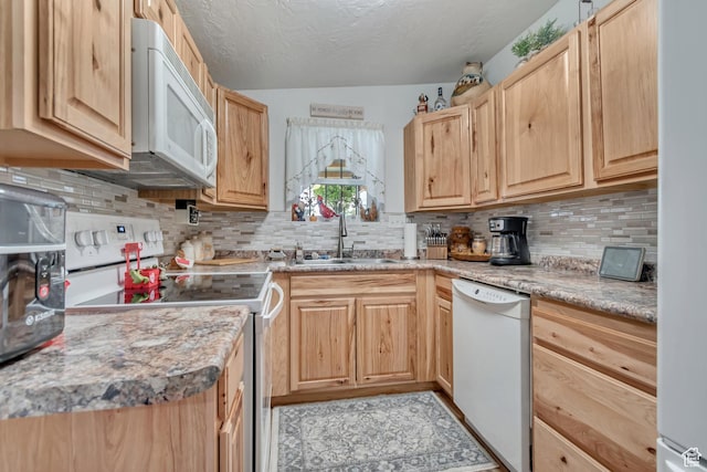 3238 S Maple Way, West Valley City, UT 84119 - kitchen featuring white appliances, a sink, light brown cabinets, decorative backsplash, and light countertops
