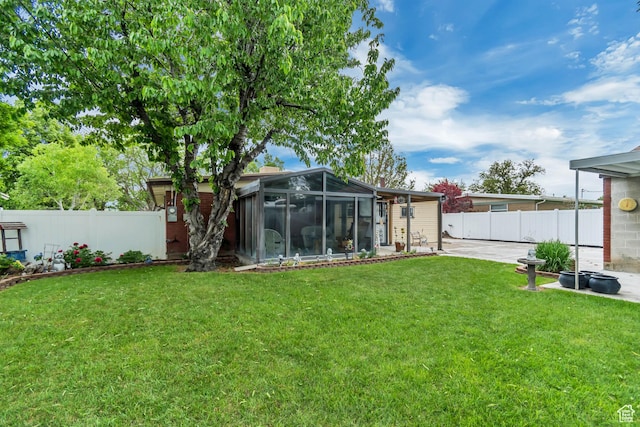 3238 S Maple Way, West Valley City, UT 84119 - view of yard with a sunroom and a patio area