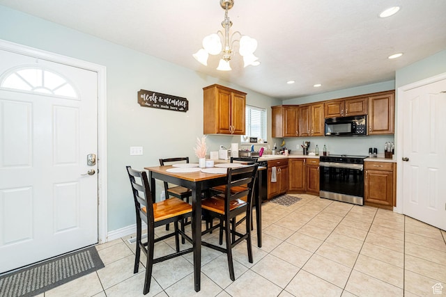 101 E 630 N # 7, Smithfield, UT 84335 - kitchen featuring range with electric cooktop, black microwave, a chandelier, light tile patterned floors, and brown cabinetry
