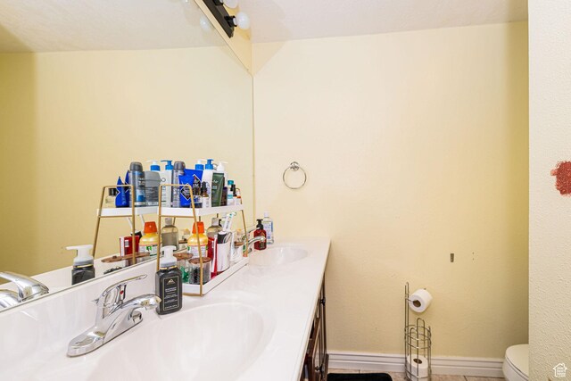 101 E 630 N # 7, Smithfield, UT 84335 - bathroom with double vanity, toilet, and baseboards