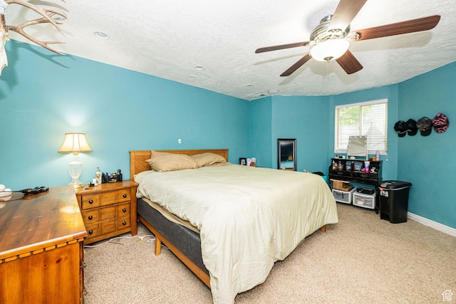 101 E 630 N # 7, Smithfield, UT 84335 - bedroom with light colored carpet, baseboards, a textured ceiling, and a ceiling fan