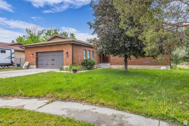 926 N 400 E, American Fork, UT 84003 - view of front facade featuring brick siding, a garage, driveway, and a front lawn