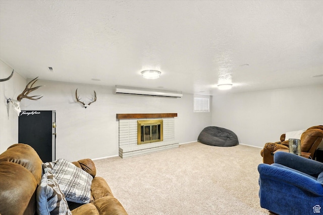 carpeted living room featuring an AC wall unit, baseboards, and a fireplace