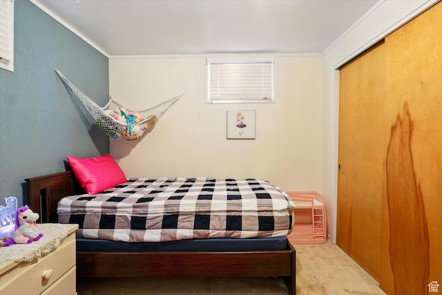 bedroom with carpet and crown molding
