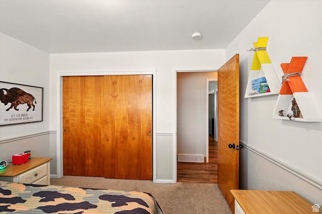 bedroom with carpet floors and a closet