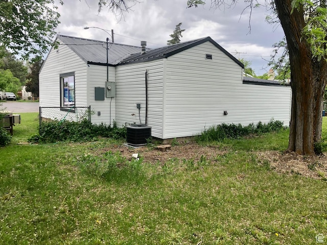 267 S Melody W, Layton, UT 84041 - view of side of property featuring a lawn, metal roof, and cooling unit