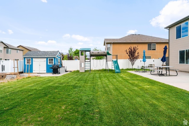 2868 W Willow Sprout Rd S, Lehi, UT 84043 - view of yard featuring a playground, a storage unit, an outbuilding, and a patio area