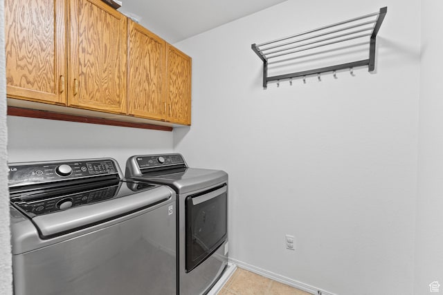 2868 W Willow Sprout Rd S, Lehi, UT 84043 - laundry room with cabinet space, separate washer and dryer, baseboards, and light tile patterned floors