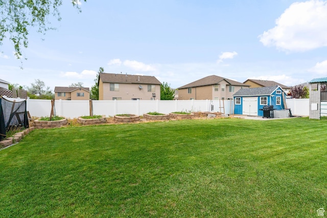 2868 W Willow Sprout Rd S, Lehi, UT 84043 - view of yard featuring a garden, a storage unit, a residential view, and an outdoor structure