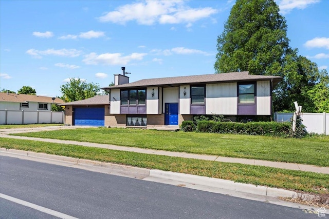 2115 N 600 W, West Bountiful, UT 84087 - bi-level home with driveway, a chimney, and a garage