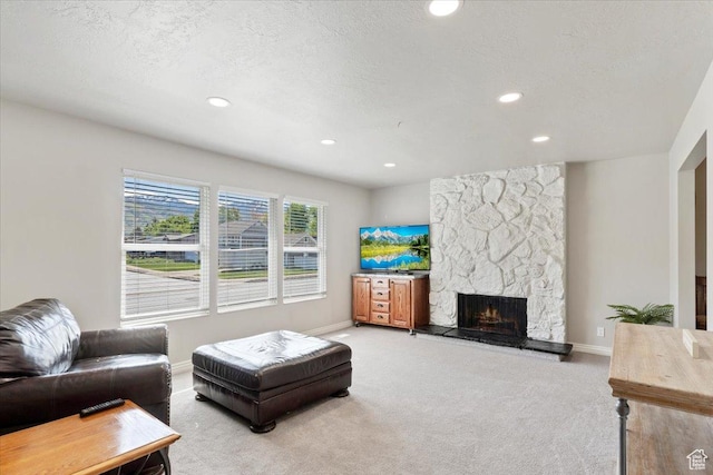 2115 N 600 W, West Bountiful, UT 84087 - living room with carpet, a stone fireplace, recessed lighting, baseboards, and a textured ceiling