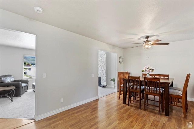 2115 N 600 W, West Bountiful, UT 84087 - dining room featuring a ceiling fan, light wood-type flooring, and baseboards