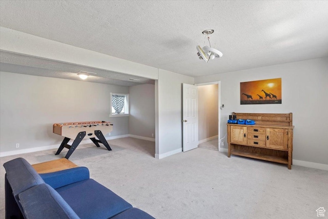 2115 N 600 W, West Bountiful, UT 84087 - rec room featuring light colored carpet, baseboards, and a textured ceiling
