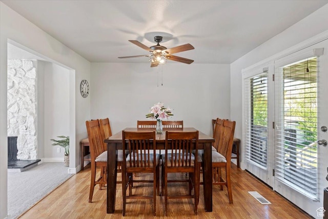 2115 N 600 W, West Bountiful, UT 84087 - dining room featuring ceiling fan, light wood-style floors, and baseboards