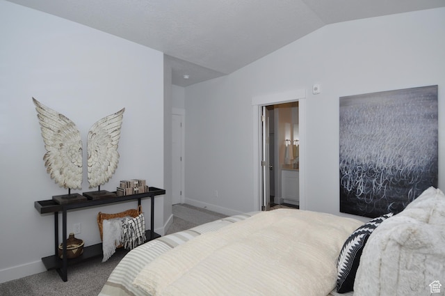 bedroom with lofted ceiling, carpet flooring, and baseboards