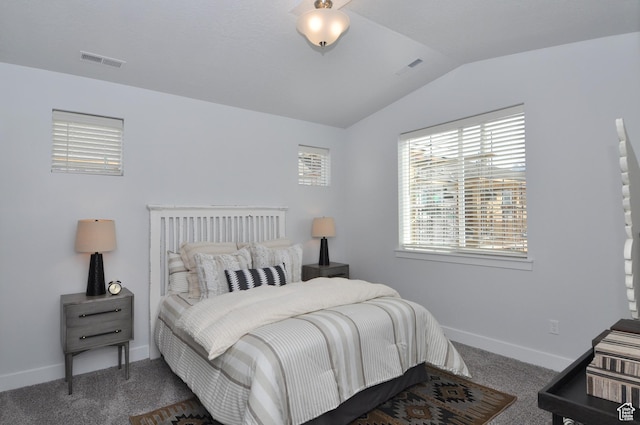 bedroom featuring vaulted ceiling, carpet flooring, and baseboards