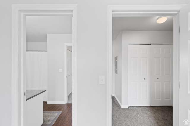hallway featuring baseboards