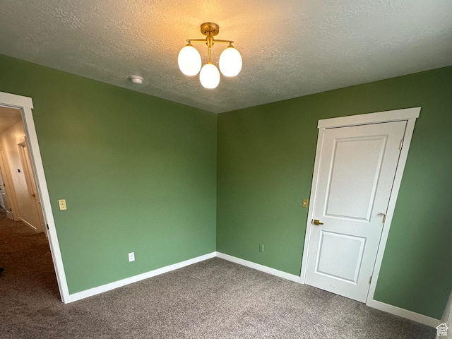 3452 W Pond Dr S, Lehi, UT 84043 - carpeted spare room with a chandelier, a textured ceiling, baseboards, and a smoke detector