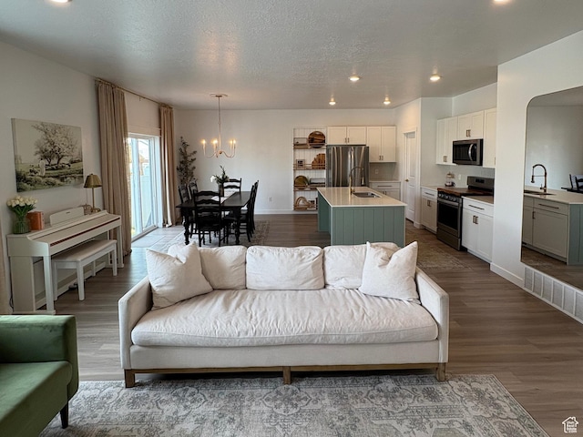 3452 W Pond Dr S, Lehi, UT 84043 - living area with a chandelier, wood finished floors, recessed lighting, and baseboards