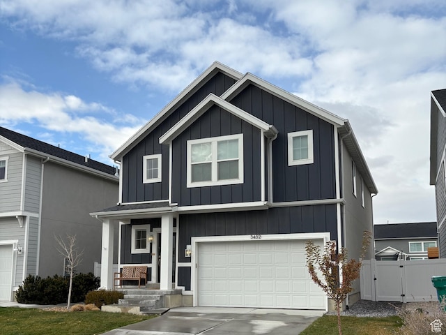 3452 W Pond Dr S, Lehi, UT 84043 - view of front of property with board and batten siding, fence, a gate, and a garage