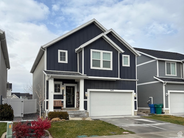3452 W Pond Dr S, Lehi, UT 84043 - view of front of home featuring board and batten siding, fence, an attached garage, and driveway