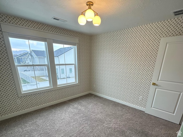 3452 W Pond Dr S, Lehi, UT 84043 - carpeted empty room with wallpapered walls, baseboards, a chandelier, and a textured ceiling