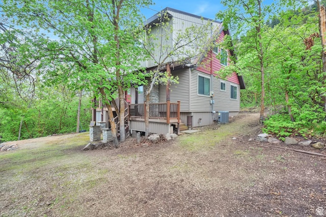 view of side of property with cooling unit