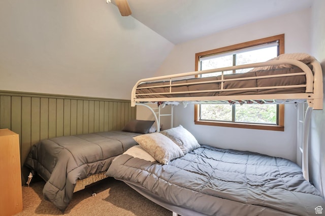 carpeted bedroom with lofted ceiling and a ceiling fan
