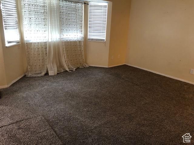 3923 W Rockwood Way Unit G, West Valley City, UT 84120 - empty room with dark colored carpet and baseboards